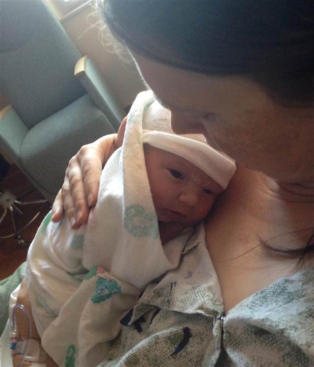 Image: Christy Wolford holds her son Lucas